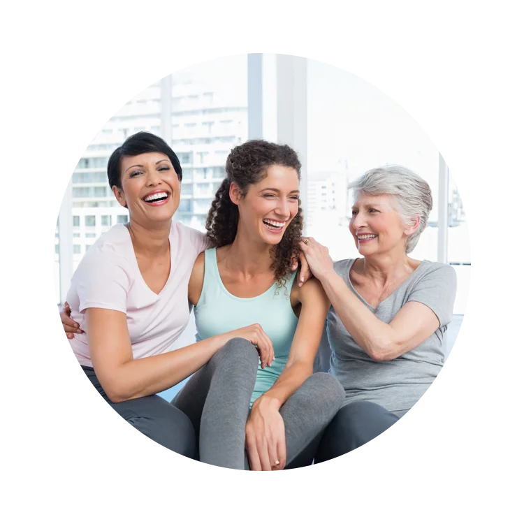 Women’s Health Pomona CA Multigenerational Woman v2 A mother, grandmother, and granddaughter all sitting together and laughing