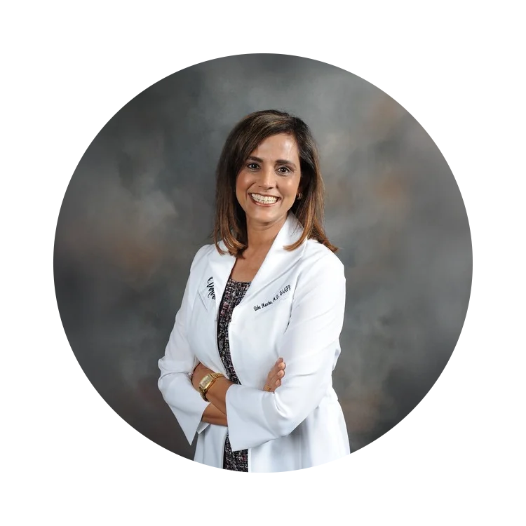 Women’s Health Pomona CA Usha Mantha HP About v2 A professional photo of Dr. Usha Mantha posing in her lab coat